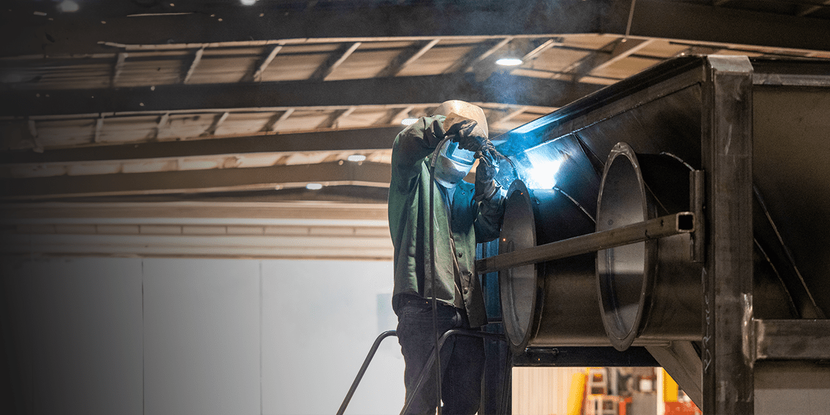 EZG employee operating the Cleveland press Benching Machine